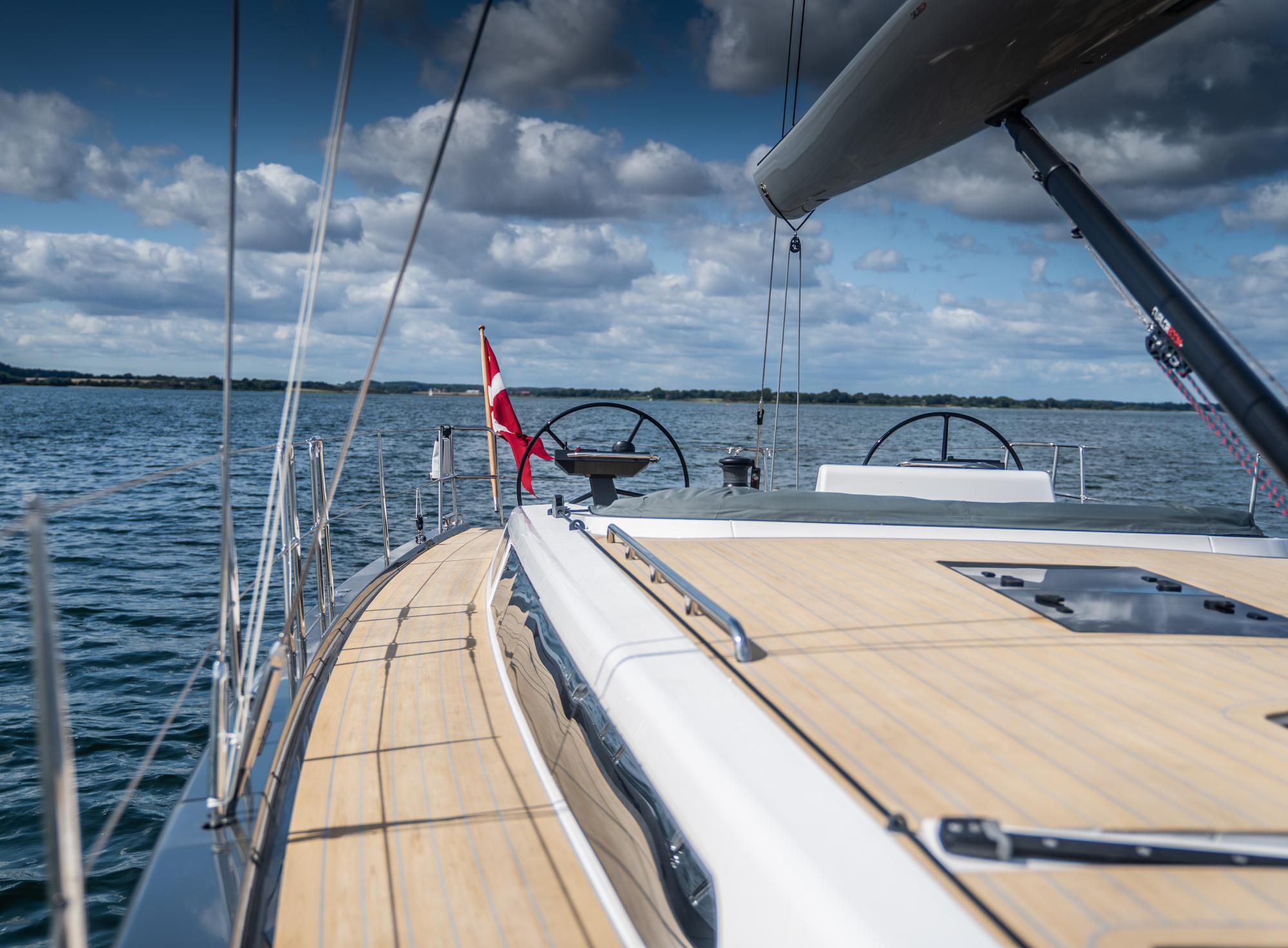 The photo shows a synthetic teak deck covering installed on a boat for a classic look.