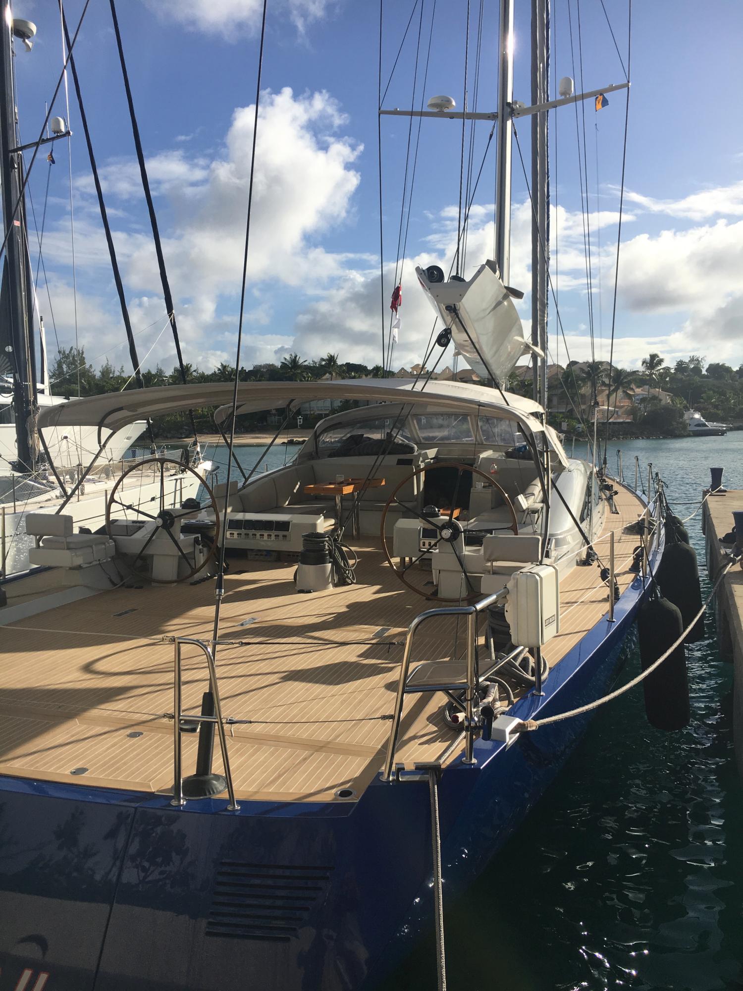 The photo shows a synthetic teak deck covering installed on a sailboat for a classic look.